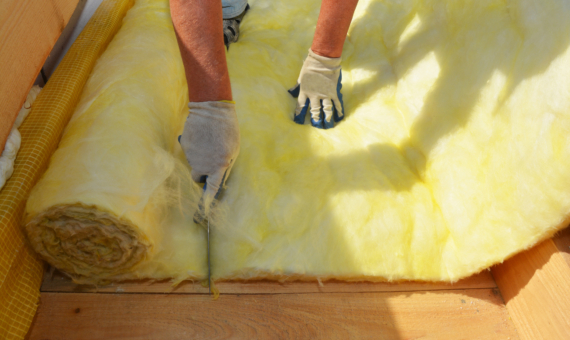Photo of person cutting into insulation