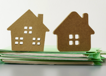Photo of cut out houses on top of files