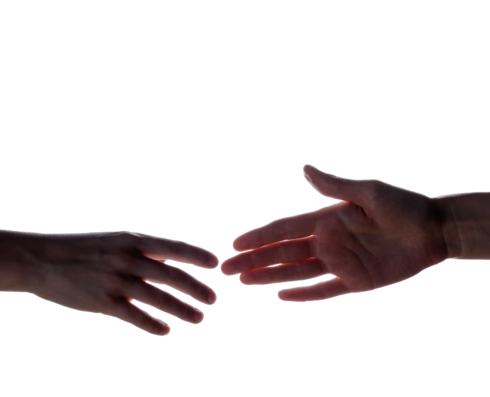 Photo of two hands reaching out to each other