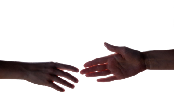 Photo of two hands reaching out to each other