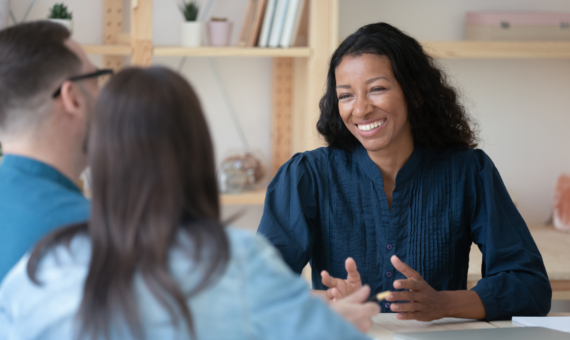 Photo of attorney speaking with clients